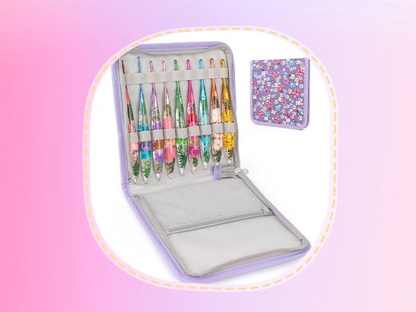 Crochet hook set in a purple zippered case with floral patterned accents, showing multiple hooks.
