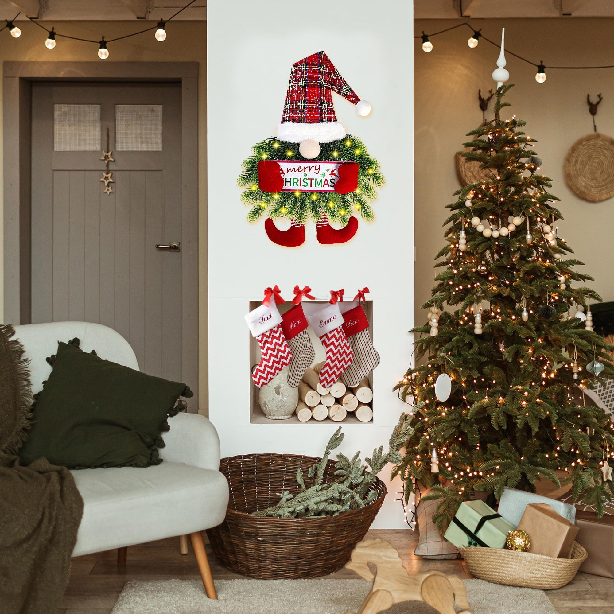 Christmas gnome wreath with plaid hat and red boots hangs above stockings on a mantelpiece next to a decorated Christmas tree.