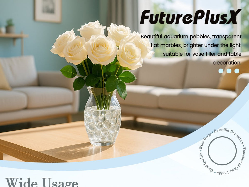 Clear flat glass marbles in a vase with white roses on a coffee table, with a sofa in the background.