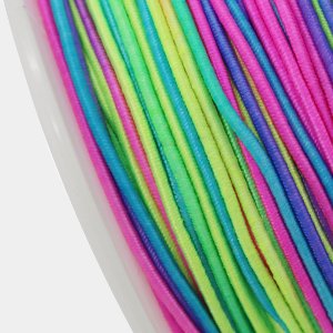 Spool of 1mm rainbow elastic beading cord in pink, yellow, green, and blue