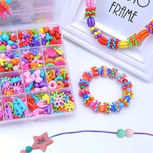 Assorted colorful beads and jewelry making supplies in a clear organizer case, with finished bracelets and necklaces nearby.