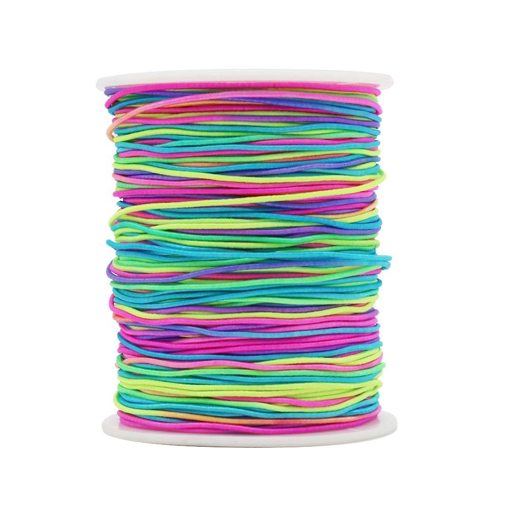 Spool of rainbow elastic beading cord with pink, blue, green, and purple strands