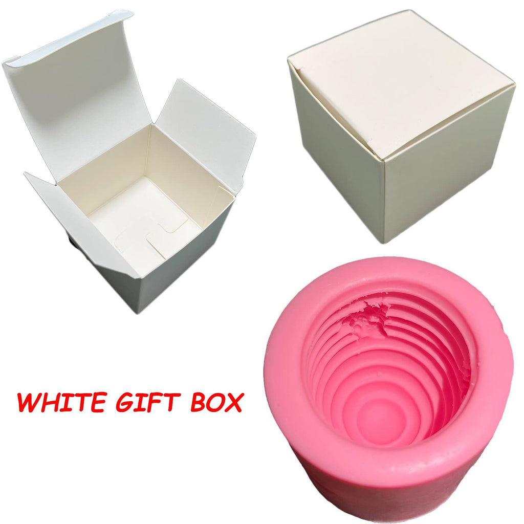 Pink beehive silicone mold and two white gift boxes on a white background
