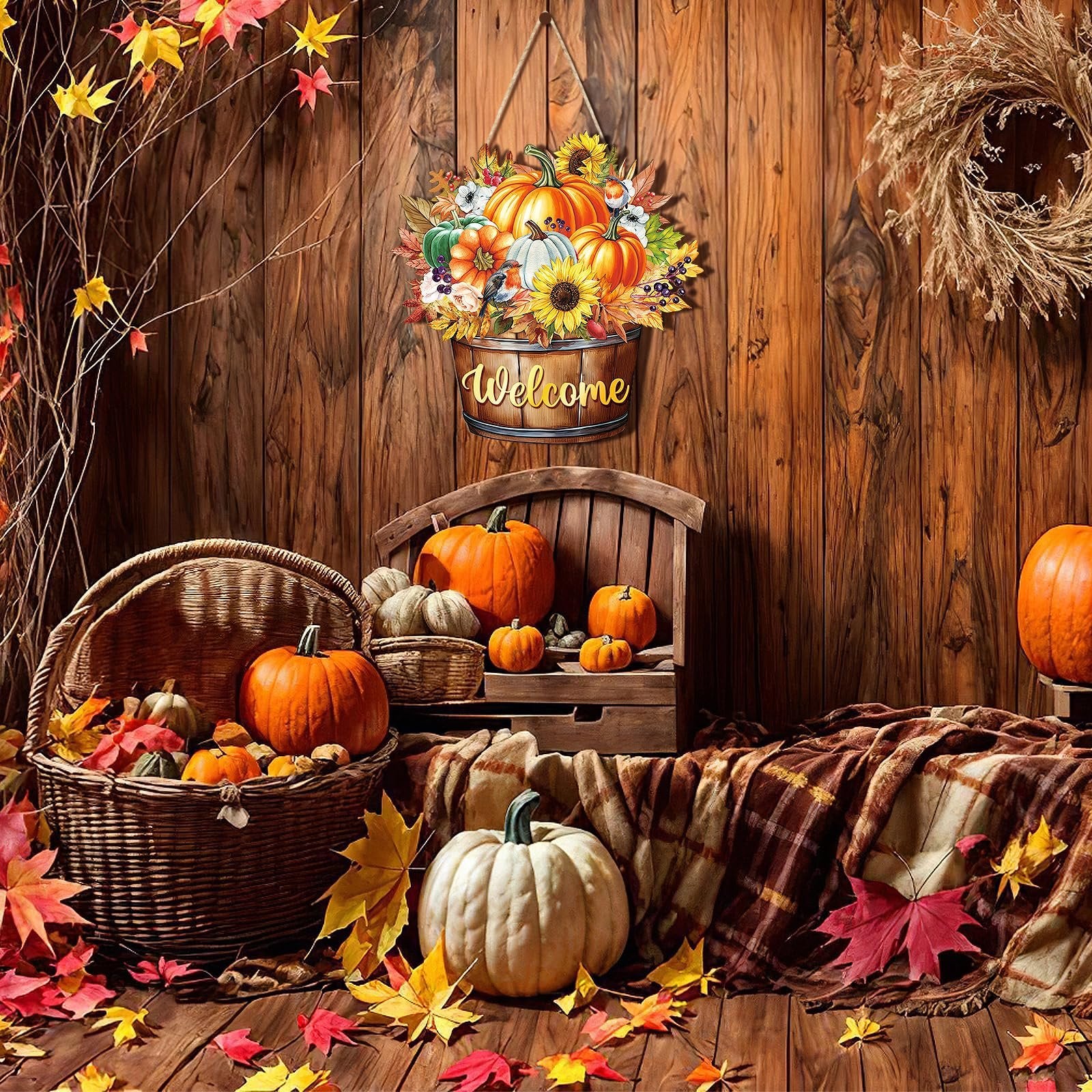 Autumn welcome door sign with pumpkins, sunflowers, and leaves hanging above a rustic display of pumpkins and fall decor.