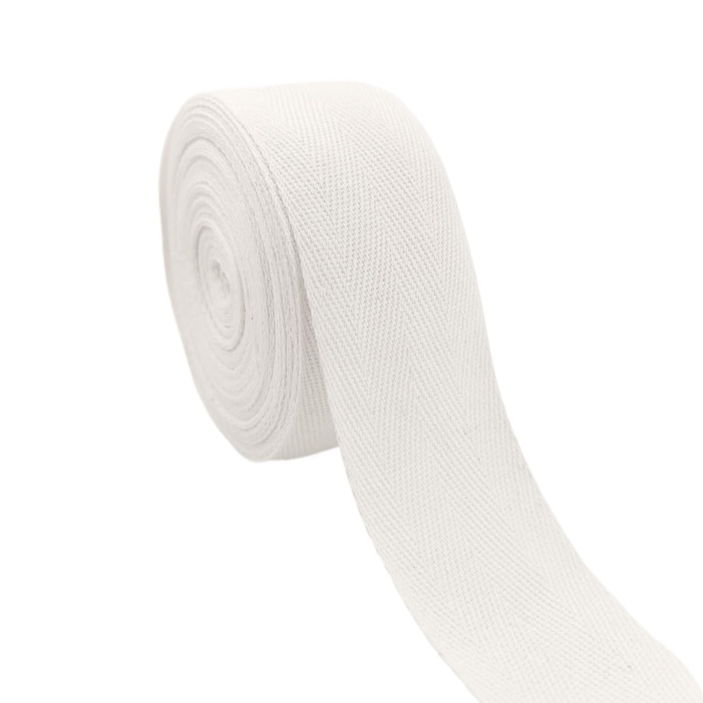 Roll of white cotton herringbone twill tape on a white background, angled view.