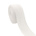 Roll of white cotton herringbone twill tape on a white background, angled view.
