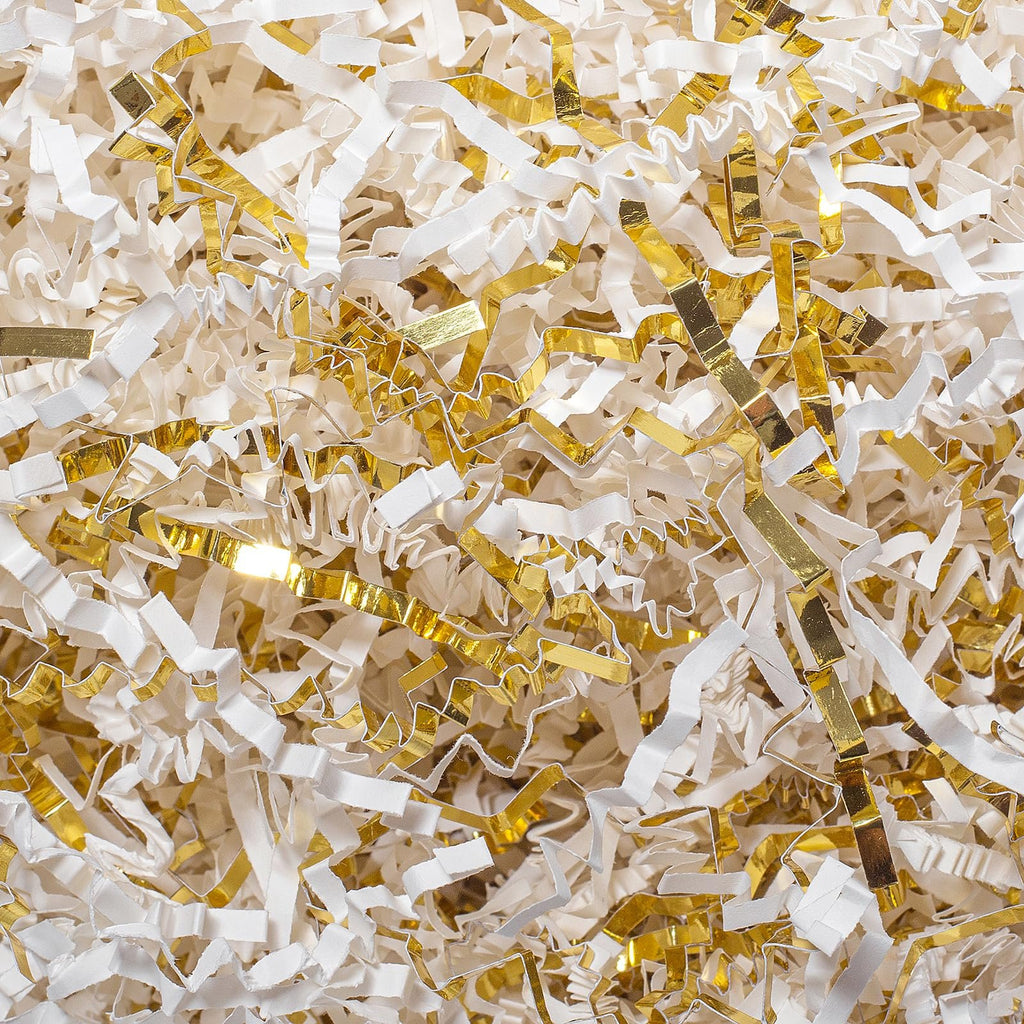 Close-up of white and gold crinkle cut paper shred filler for gift boxes and baskets.