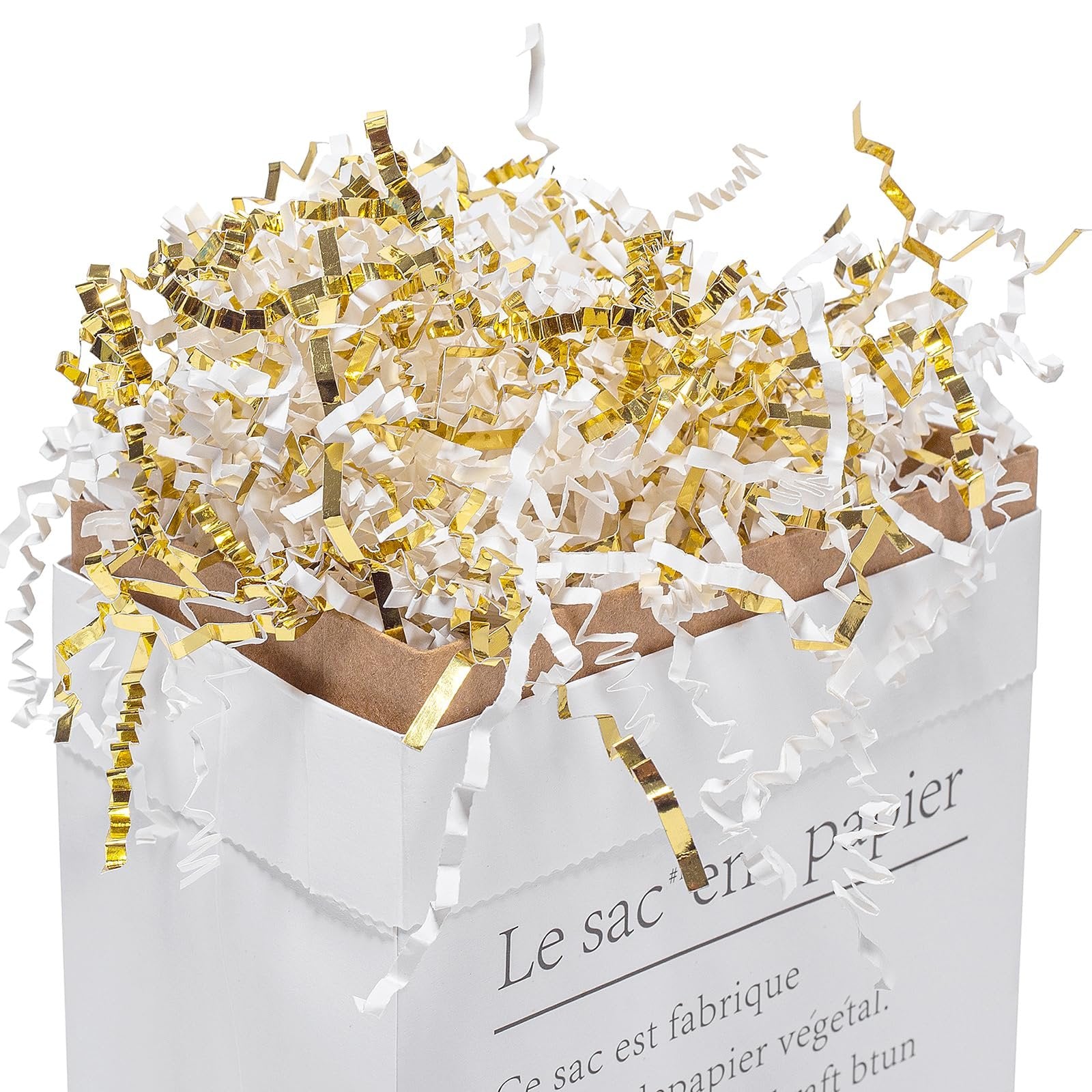 White and gold crinkle cut paper shred filler overflowing from a white paper bag.