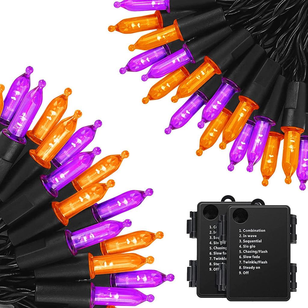 Orange and purple Halloween string lights with black wires and battery packs showing mode options