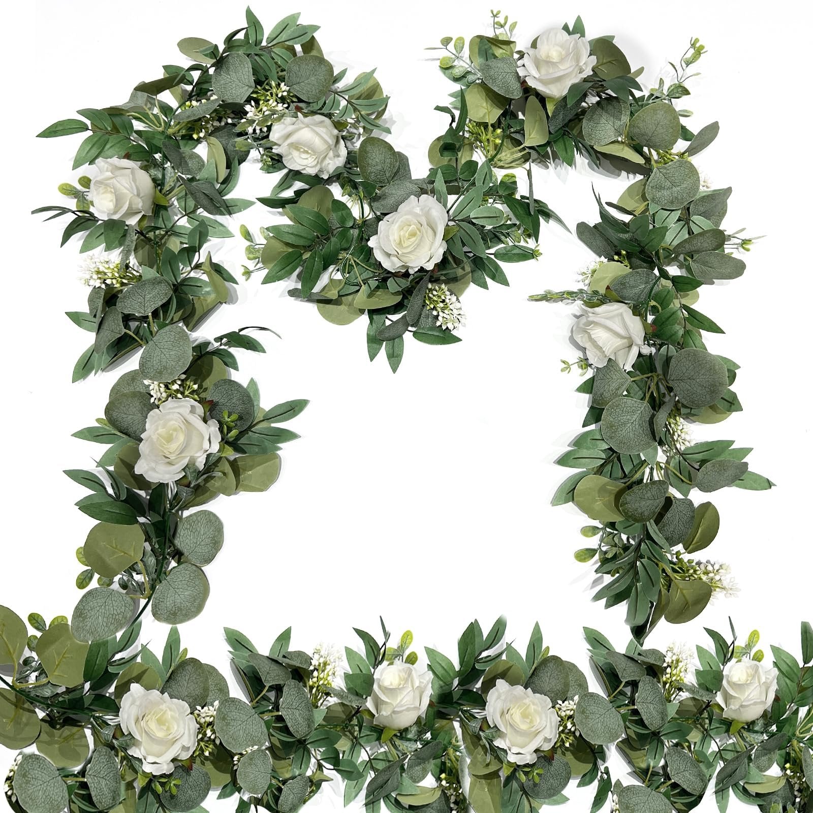 Artificial eucalyptus and white rose garland arranged in a decorative frame on a white background.