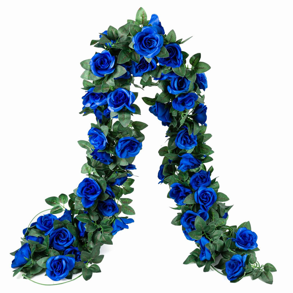 Artificial royal blue rose vine garland with green leaves, displayed against a white background.