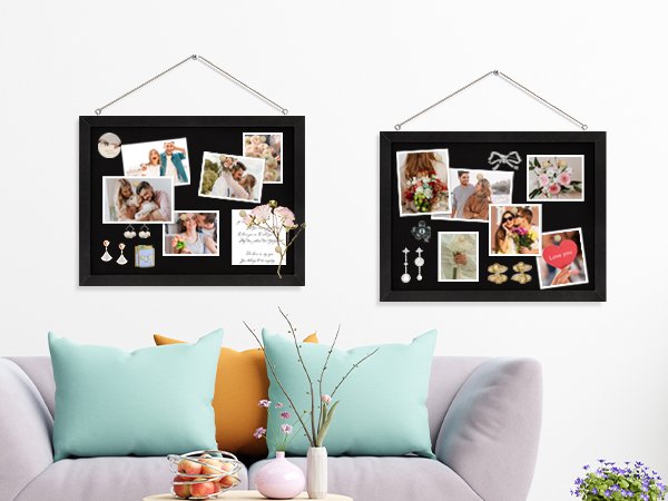 Two black cork boards with white wood frames displaying photos and accessories, hanging on a wall above a sofa.