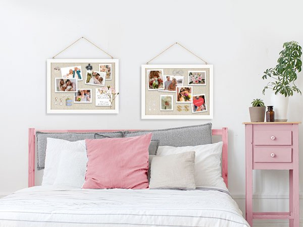 Two white framed cork boards with photos and decorations hanging on a wall above a bed.