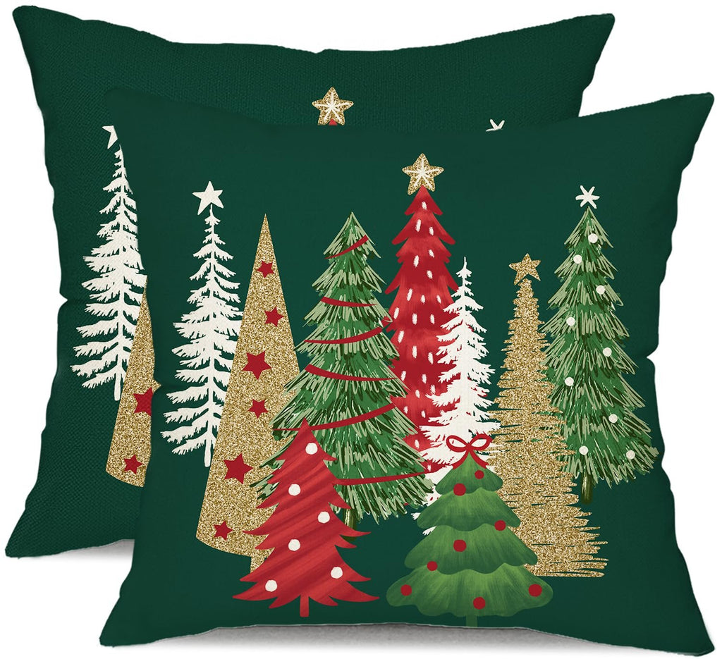 Two green Christmas tree pillow covers with various decorated trees, some with glitter accents.