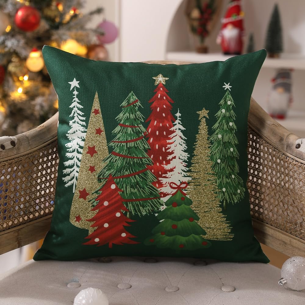 Green Christmas tree pillow cover with glitter accents, displayed on a chair with a Christmas tree in the background.