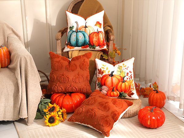 Fall decor arrangement with faux fur pumpkin throw pillows, decorative pumpkins, and sunflowers on a chair and rug.