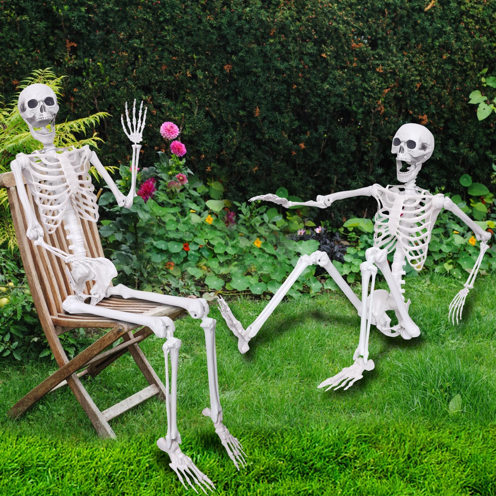 Two posable plastic skeletons in a garden setting, one sitting on a chair, the other on the grass.