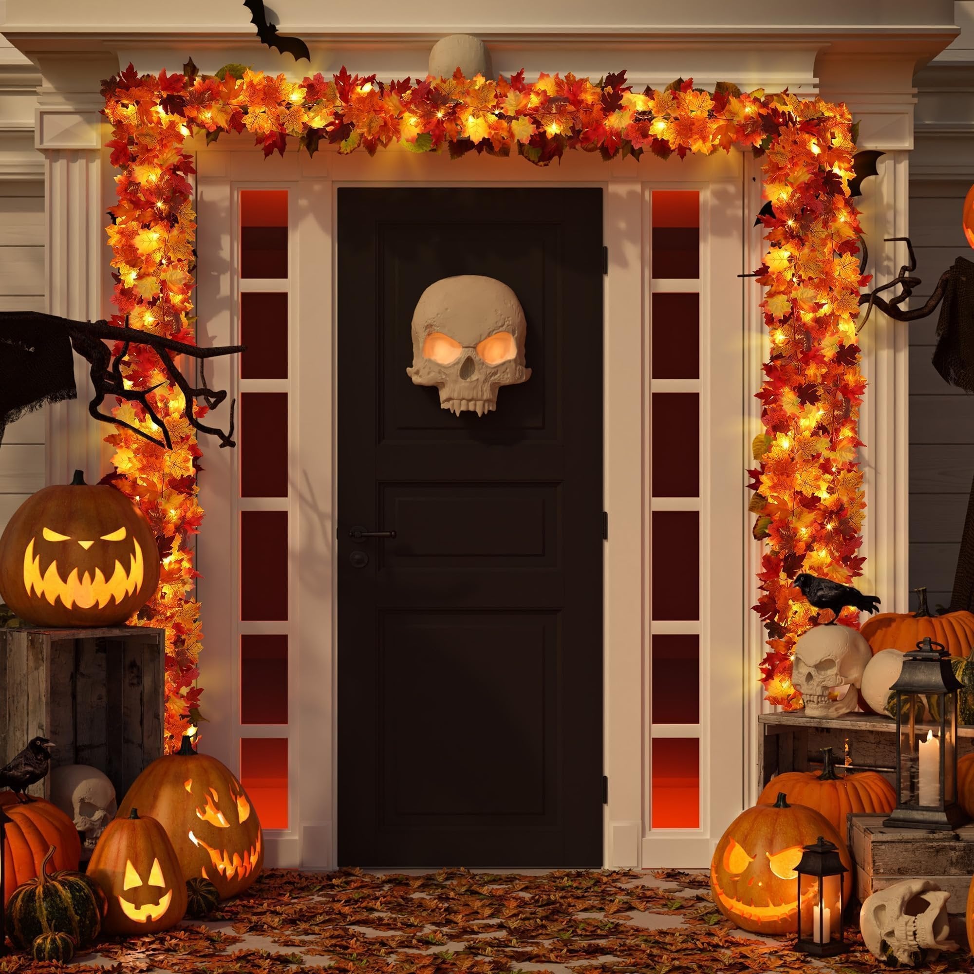 Front door decorated for Halloween with artificial maple leaf garland and pumpkins
