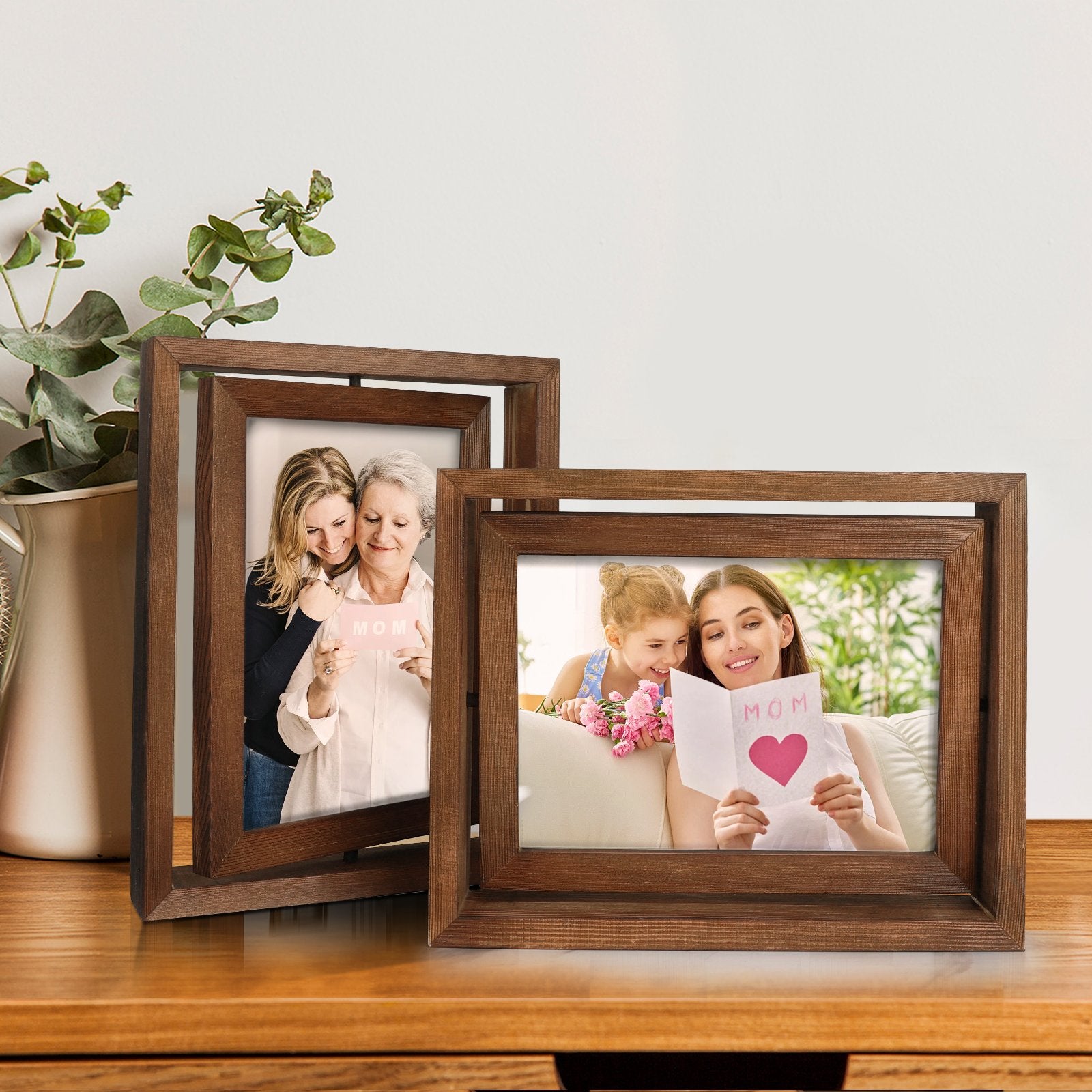 Two wooden rotating picture frames displaying family photos, one with a mother and daughter, the other with a grandmother and granddaughter.