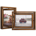 Two distressed wood rotating floating picture frames displaying photos of a teddy bear and toy van.