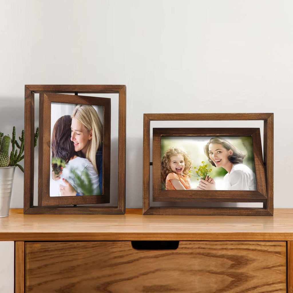 Two distressed wood rotating picture frames displaying family photos on a wooden surface with a cactus in a pot.