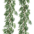 Two artificial willow vine garlands with green silk leaves and brown plastic stems against a white background.