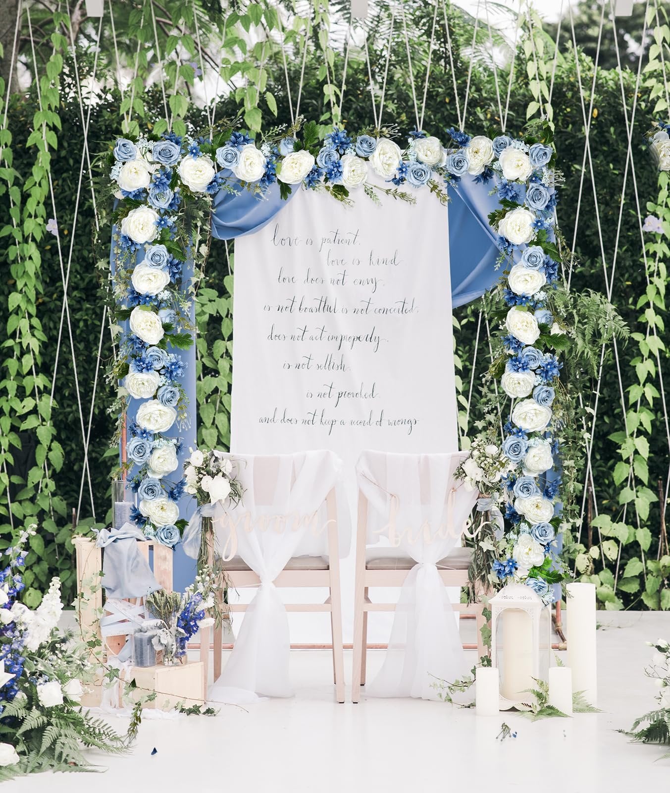 Wedding arch decorated with blue and white silk peonies, featuring a banner with text and two chairs labeled 'Groom' and 'Bride'.