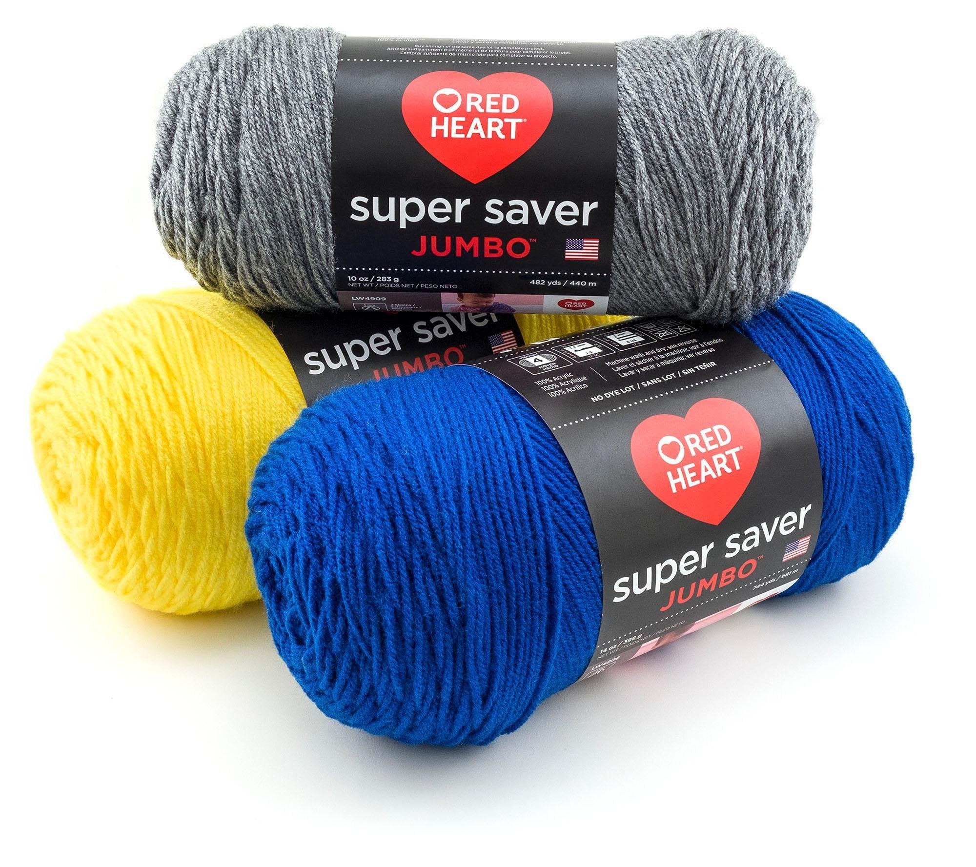 Three skeins of yarn in grey, yellow, and blue, stacked and angled on a white background.