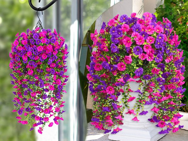 Two hanging baskets of artificial petunia flowers in fuchsia and rose red, one hanging from a hook and the other in a white planter.