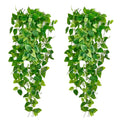Two artificial ivy hanging vines with green leaves against a white background