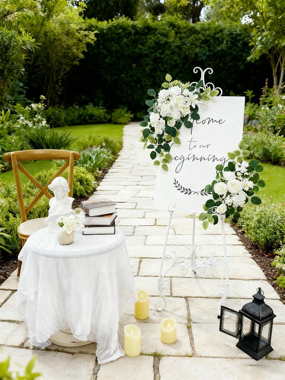 Wedding welcome sign with floral arrangements and text 'come to our beginning' in a garden setting.