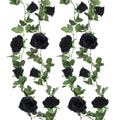 Two black artificial rose garlands with green leaves on a white background, shown from the front.