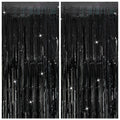 Two black tinsel fringe curtain backdrops with sparkling star accents, displayed side-by-side.