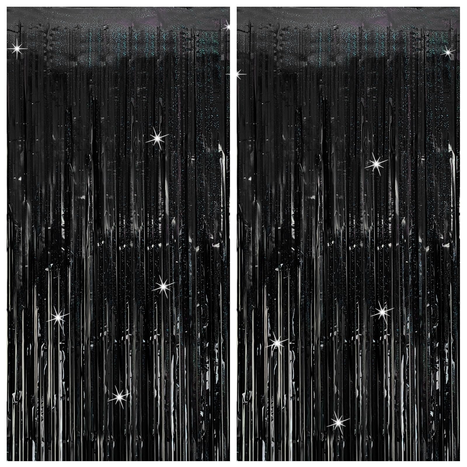 Two black tinsel fringe curtain backdrops with sparkling star accents, displayed side-by-side.