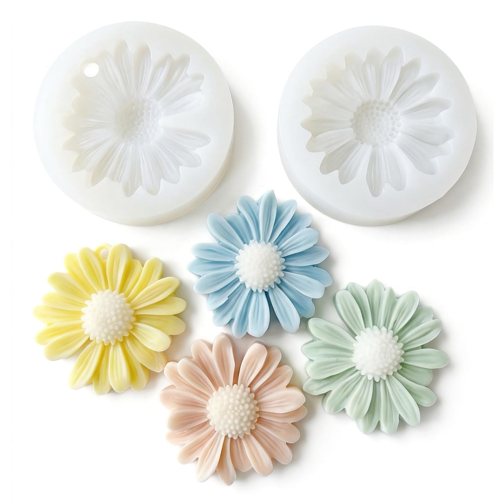 Two daisy-shaped silicone molds and five colorful flower-shaped soap/wax melts on a white background.