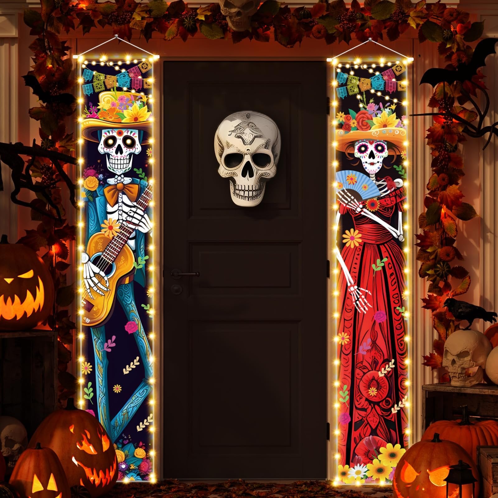 Dia de los Muertos porch banners with skeleton couple, one playing guitar, the other holding a fan, illuminated by string lights.