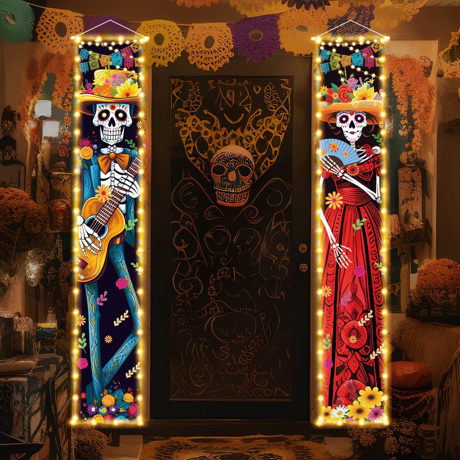 Dia de los Muertos porch banners with skeleton figures, one playing guitar, the other holding a fan, illuminated by string lights.