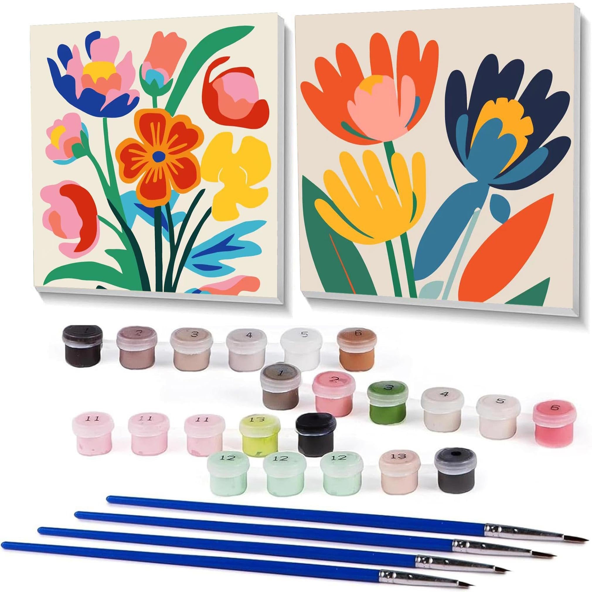Two framed floral paint by number canvases with acrylic paint pots and brushes