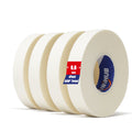Four rolls of white artist tape on a white background, one roll shows a blue core with branding.