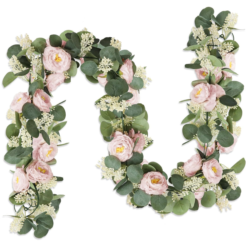 Artificial eucalyptus garland with pink roses and white flowers on a white background