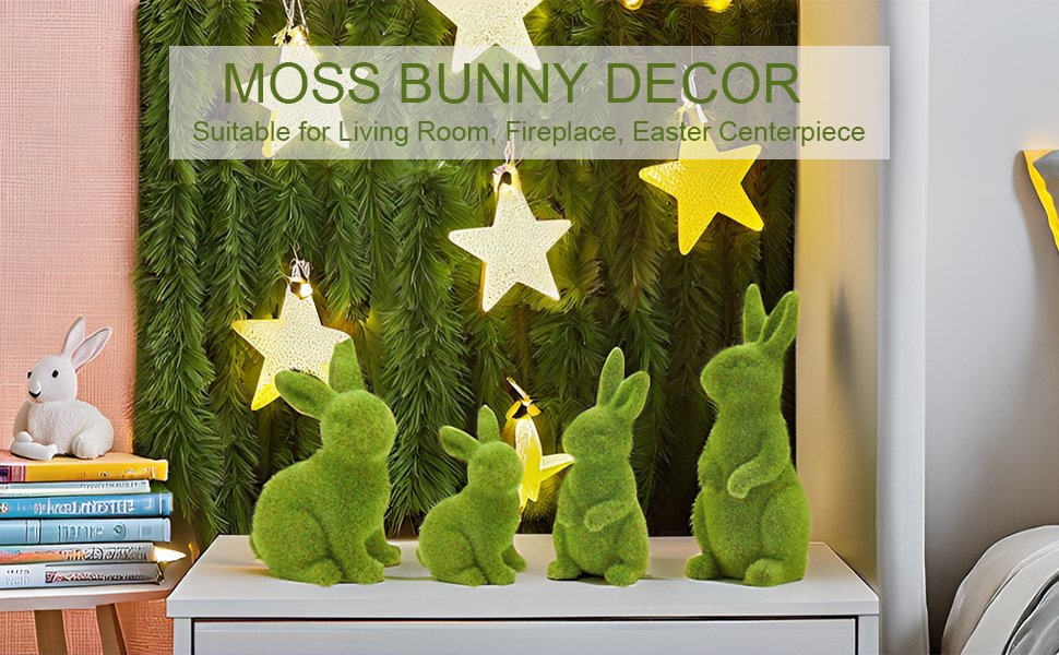Four flocked moss bunny figurines displayed on a white surface with a green garland and star lights in the background.