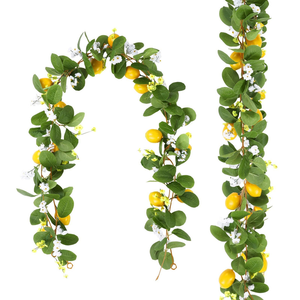 Two artificial lemon vine garlands with green leaves, white flowers, and yellow lemons against a white background.