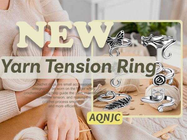 Close-up of adjustable metal yarn tension rings with cat, butterfly, rose, feather, and leaf motifs, surrounded by yarn and buttons.