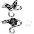 Two adjustable metal yarn tension rings, one with a butterfly motif and the other with a rose motif, shown with a small clear storage box.