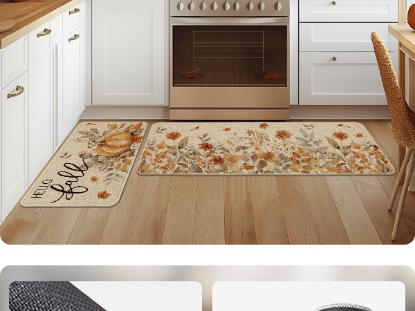 Two fall-themed kitchen mats with pumpkins and floral designs on a wooden floor in front of a stove and cabinets.