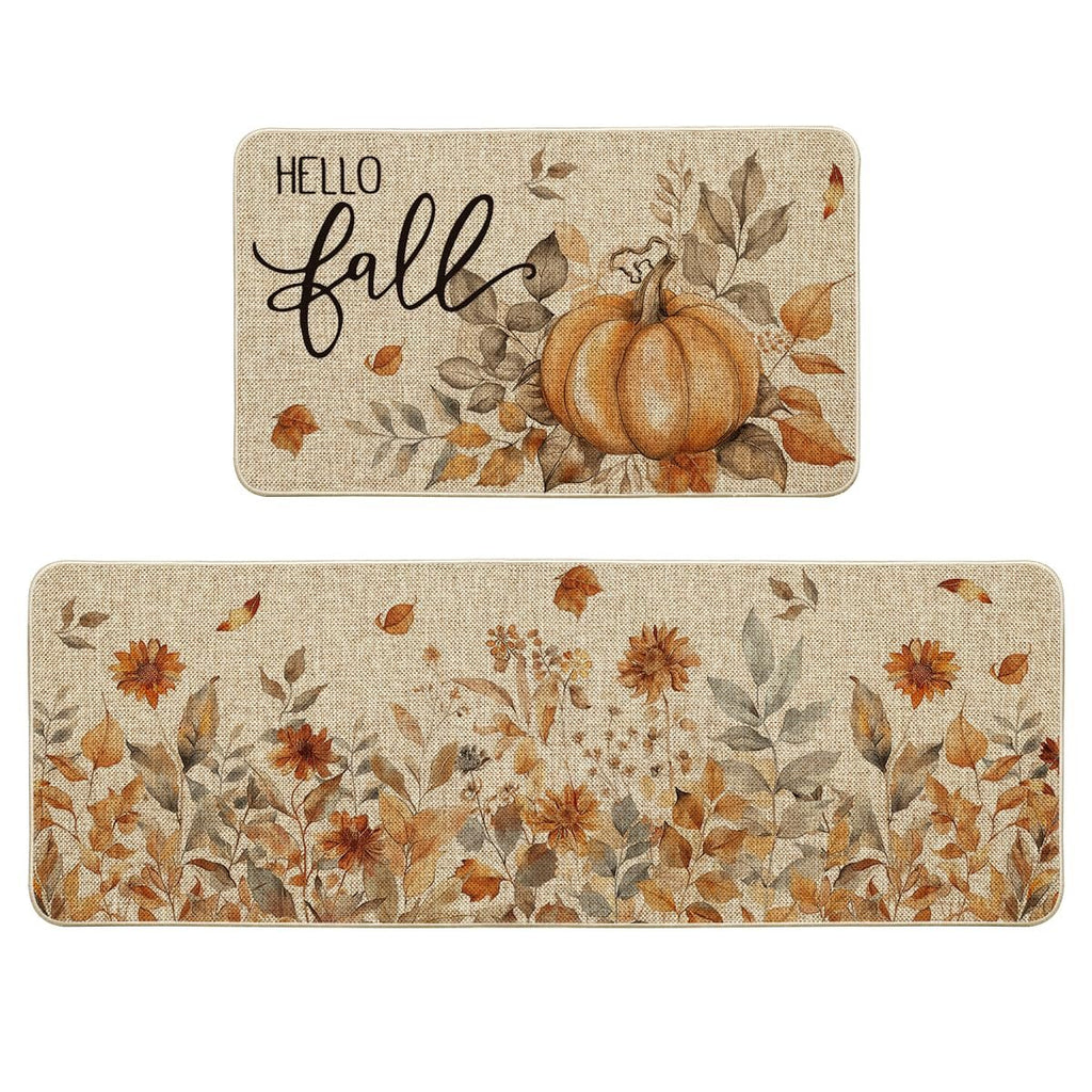 Two fall-themed kitchen mats, one with a pumpkin and 'Hello Fall' text, the other with floral and leaf designs.