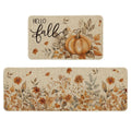 Two fall-themed kitchen mats, one with a pumpkin and 'Hello Fall' text, the other with floral and leaf designs.