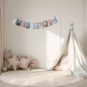 Boho wooden bead garland photo display with clips hanging above a teepee and plush toys in a nursery.