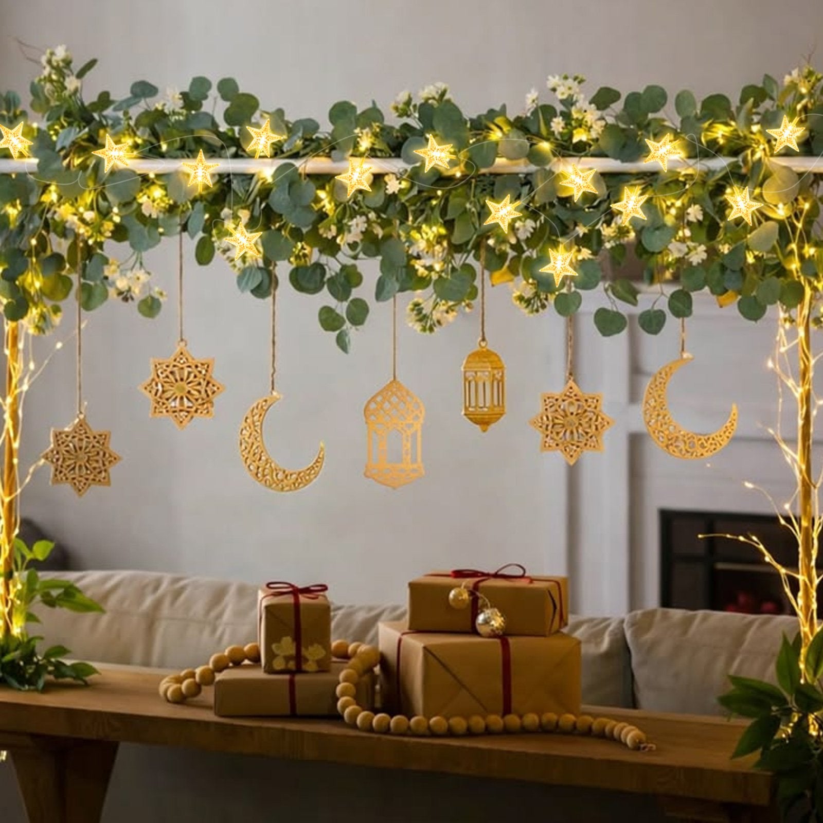 Warm white star string lights draped over greenery with Ramadan-themed ornaments and gift boxes on a table
