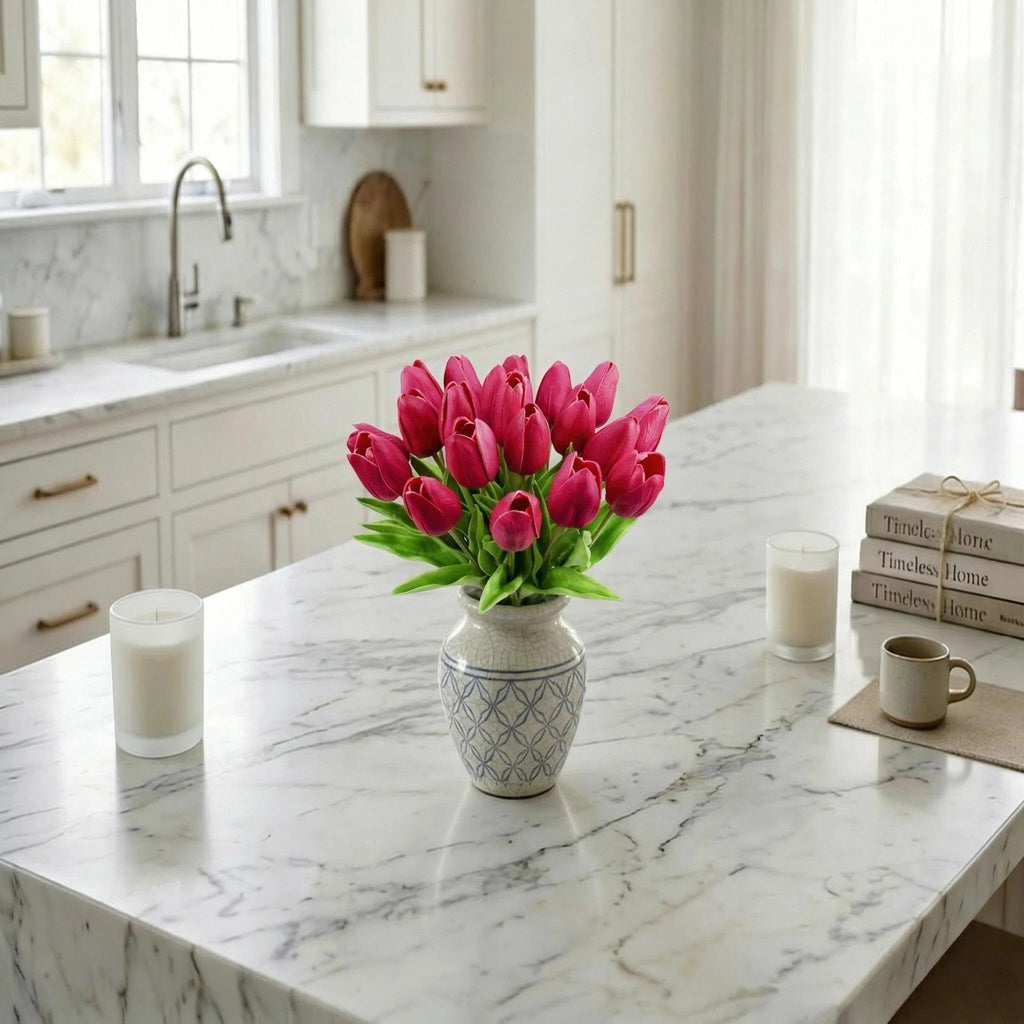 Bouquet of 20 hot pink artificial tulips in a decorative vase on a marble countertop.